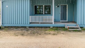 A single-story house with a porch, a front door, and a small set of steps leading up to the entrance. - Saarihely a1 by Interhome (Inari)