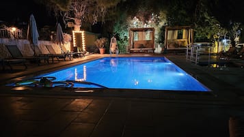 Seasonal outdoor pool, open 10:00 AM to 8:00 PM, pool umbrellas