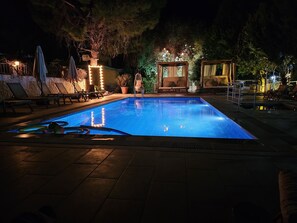 Seasonal outdoor pool, open 10:00 AM to 8:00 PM, pool umbrellas