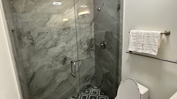 Shower, towels, soap, toilet paper