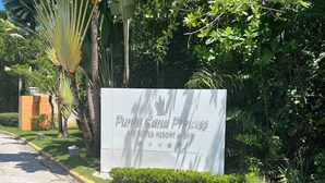 A sign for Punta Cana Princess resort, indicating it offers all suites, resort, and spa services. - Beautiful 2-bed Apartment in Punta Cana (Punta Cana)