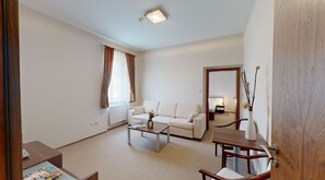 Standard Apartment | Living area | 72-cm flat-screen TV with satellite channels