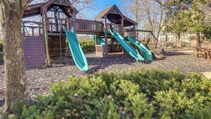A playground with slides and climbing structures. - Elegant Pigeon Forge Condo w/ Golf Course View! (Pigeon Forge)