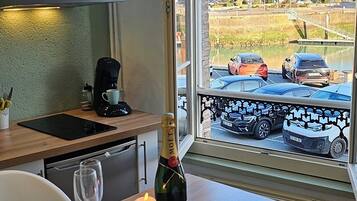 Fridge, microwave, stovetop, coffee/tea maker