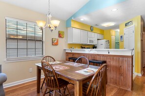 Enjoy meals in this kitchen with a central island and dining area.