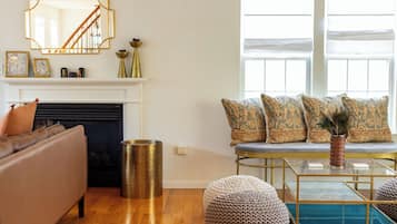 Smart TV, fireplace, books, computer monitors