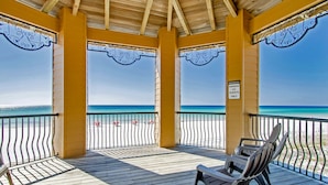 A wooden deck with a view of the ocean, a sign indicating it's for owners and guests only, and a bench. - Ground Floor Condo with Gorgeous Views (Miramar Beach)