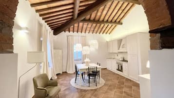 Luxury Apartment, 1 Queen Bed | Living area | 32-inch LED TV with cable channels, streaming services