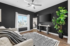 Luxury Apartment | Living area | 65-inch LCD TV with digital channels, Netflix, Hulu - Midnight Manor Penthouse Suite The Gulch (Nashville)