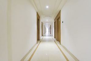 Guest rooms line the corridor, each with its own entrance.