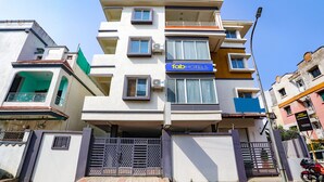 A multi-story building with a 'Fab Hotels' sign, air conditioning units, and a gated entrance. - Fabhotel Hrg Destiny (Nagpur)