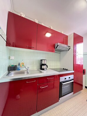 Enjoy cooking in this kitchen with a sink, coffee maker, and gas stove.