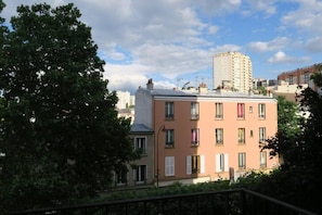 Stylish urban residence with a flat roof and balcony.