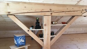 A wooden staircase with shelves holding various items. - Relaxation on 2 levels; hiking,cycling from the house, skiing in the surrounding (Großweil)
