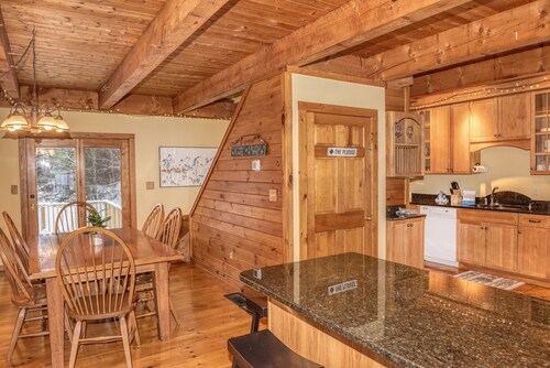 The Whimsical Chalet is a lovely cape on acres. Private setting less than 10 minutes to skiing.