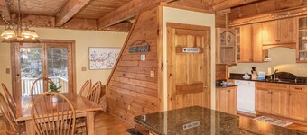 The Whimsical Chalet is a lovely cape on acres. Private setting less than 10 minutes to skiing.