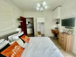 1 bedroom, desk, iron/ironing board, bed sheets