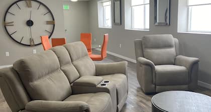 Contemporary 1400 sq ft space in lower level Open concept gas burning fireplace