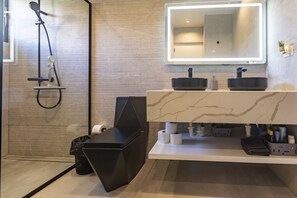 Shower, hair dryer, towels, toilet paper