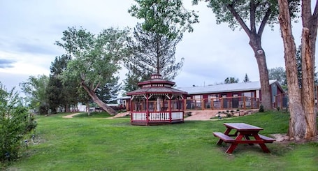 Outdoor dining. Quaint Single King Hotel Room overlooking the Gunnison River and your Private Patio! Perfect for fishing and exploring the outdoors.