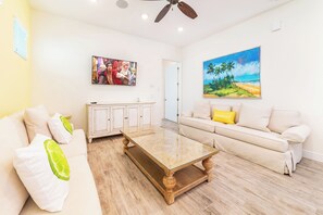 Living area - Sunkissed Cottage with Hot Tub near Disney with Margaritaville Resort & Island. (Kissimmee)