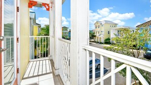 A balcony with a view of neighboring houses and a clear sky. - Sunny Cottage near Disney | Margaritaville & Waterpark Access - 3013SP (Kissimmee)