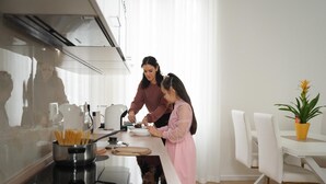 A modern kitchen with a dining area. - Golden Teal apartment (BERGAMO)