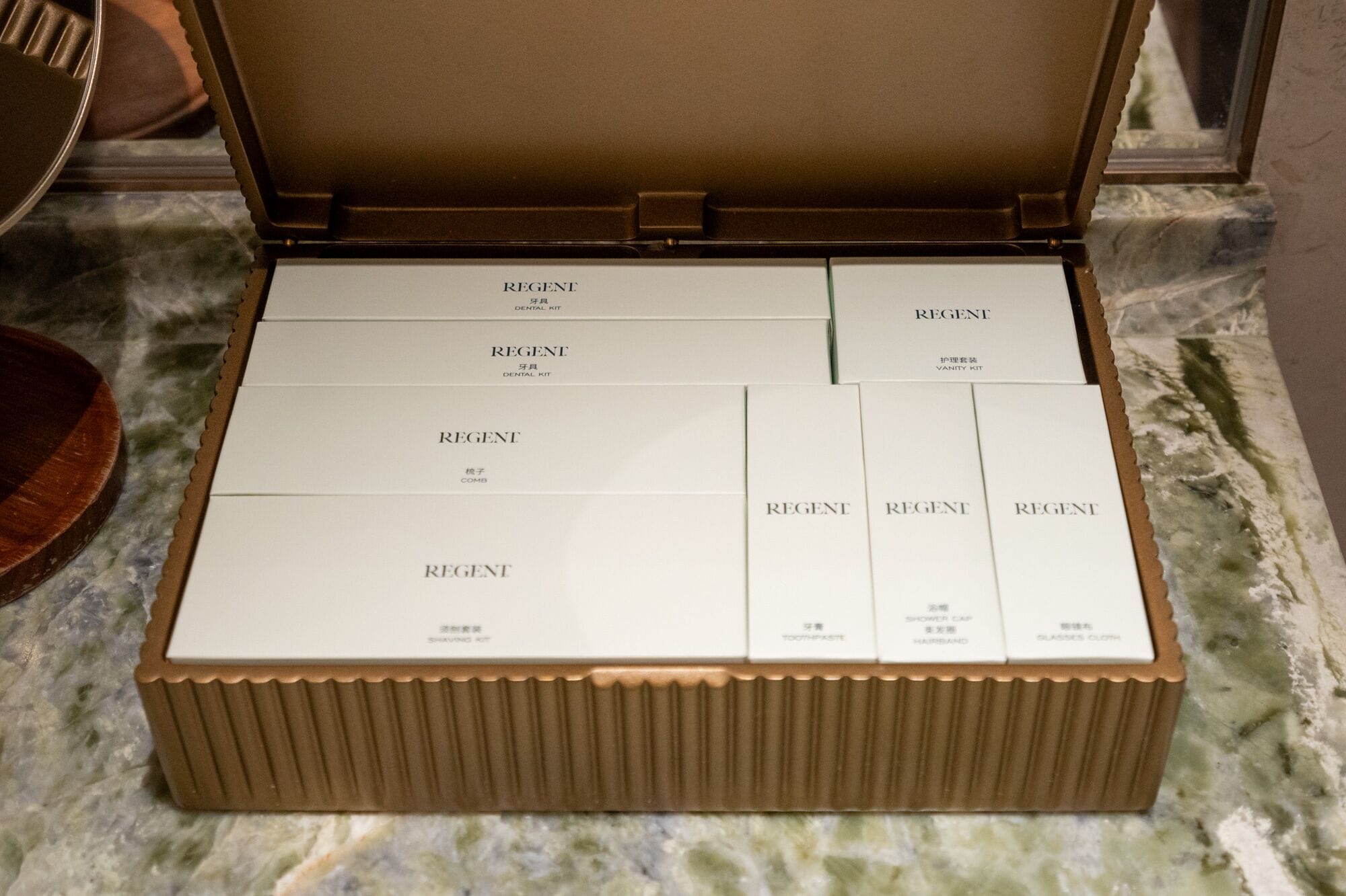 A Regent dental kit box with compartments for various items.