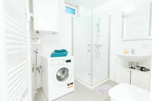 Shower, hair dryer, towels, soap