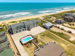 A coastal hotel with a swimming pool, beach access, and multiple buildings. - Family-Friendly Condo w/ Pool & Beach (Kill Devil Hills)