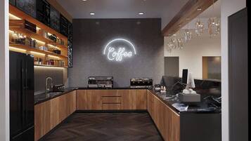 A modern coffee shop interior with wooden cabinetry, a neon sign, and pendant lighting.