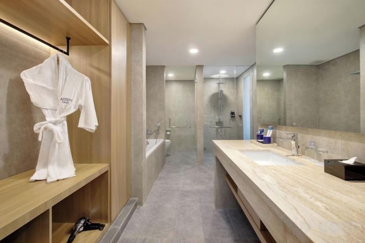 Shower, hair dryer, slippers, towels