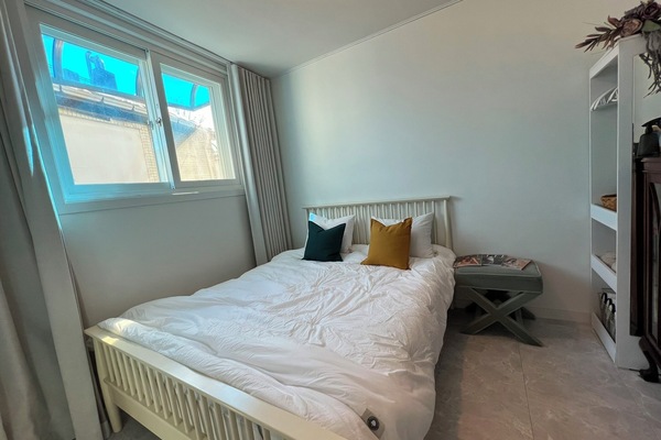 Serene primary bedroom with a queen bed and hotel-quality Supima cotton bedding