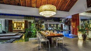 A modern interior with a dining area, a pool, and a bedroom with a view. - Beautiful Villa with Private Pool & Sunny Environment, Bali Villa 2138 (Bali)