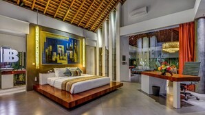 A modern hotel room with a large bed, a cityscape painting, and a view of the outdoors. - Beautiful Villa with Private Pool & Sunny Environment, Bali Villa 2138 (Bali)