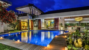 A modern hotel with a swimming pool, a dining area, and a well-lit interior. - Beautiful Villa with Private Pool & Sunny Environment, Bali Villa 2138 (Bali)
