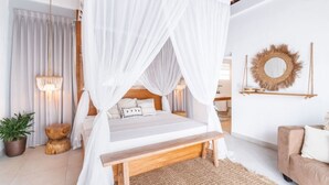 A bedroom with a canopy bed, a wooden bench, a sofa, a hanging mirror, and a potted plant. - Beautiful 6BR Villa W/Pool & Spa room, Bali villa 2238 (Bali)