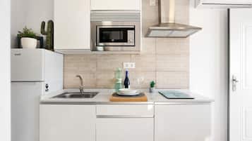 Fridge, microwave, stovetop, coffee/tea maker