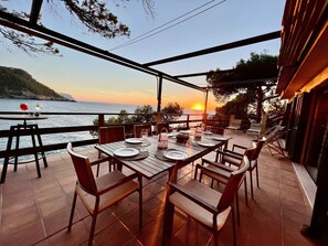 Outdoor dining - Holiday Home 'Villa Banyalbufar' in front of the beach with stunning sea view (Banyalbufar)