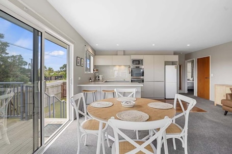 Dining. Modern 2-Bedroom Oasis, Just Steps from the Beach