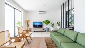 Premium Villa | Living area | 32-inch Smart TV with cable channels