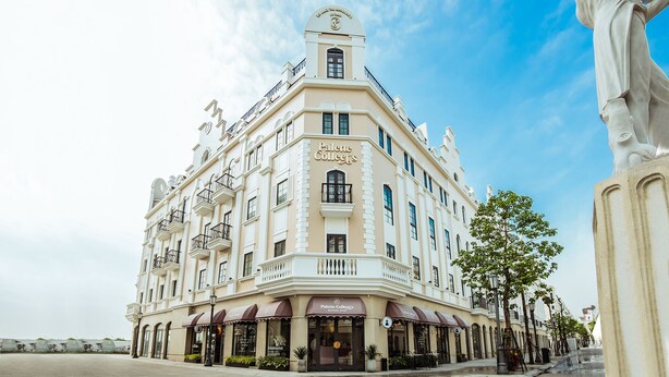 A historic building with a prominent sign for 'Palace College'. - Palette Collect's Boutique Hotel Ha Long (Bai Chay)