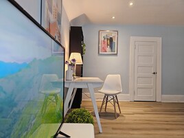 Deluxe Suite | Living area | Flat-screen TV