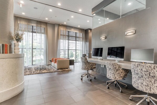 Work in style with a curved reception desk and comfortable seating area.