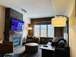 Family Suite | Living area | 50-inch Smart TV with cable channels, fireplace - Mountain Retreat - Heated Pool & Hot-tub (Canmore)