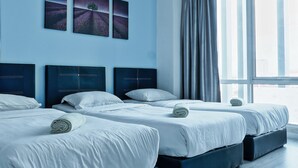 A hotel room with three beds, a large window with curtains, and two landscape paintings on the wall. - reStary Blue Game Themed Homestay (Kota Kinabalu)
