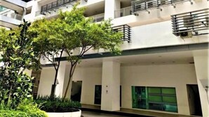 A multi-story building with a modern architectural design, featuring balconies and large windows. - reStary Blue Game Themed Homestay (Kota Kinabalu)