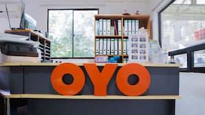 A reception desk with the word "OYO" prominently displayed. - Hotel O The 7 Lodge Tambunan (Tambunan)