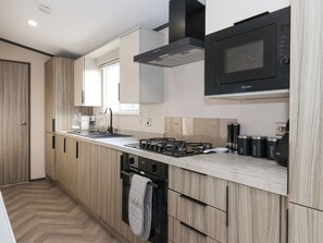 Fridge, electric kettle, toaster, cookware/dishes/utensils