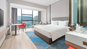 A modern hotel room with a large bed, a desk, a chair, and a TV. - Holiday Inn Express Bazhong Center by IHG (Bazhong)